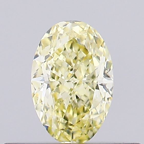 Actual 0.28 carat Fancy Yellow Oval lab-grown diamond