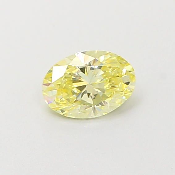 Actual 0.32 carat Fancy Yellow Oval lab-grown diamond