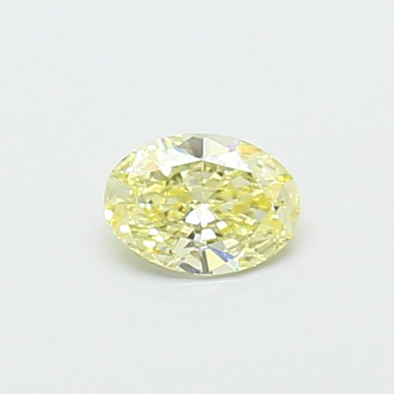 Actual 0.32 carat Fancy Yellow Oval lab-grown diamond