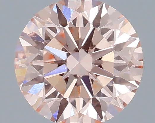 Actual 0.34 carat Fancy Intense Pink Round lab-grown diamond